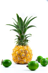 Little baby pineapple with other exotic fruits beautiful composition on white isolated background vertical photo
