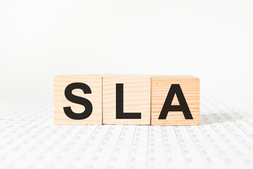 word SLA on wooden blocks, white background, business concept. business and Finance