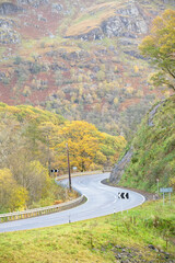 Dangerous road corner bend at Loch Lomond during Autumn