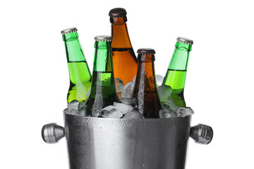 Metal bucket with bottles of beer and ice cubes isolated on white