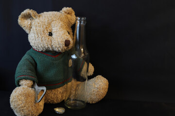 teddy bear with bottle and opener