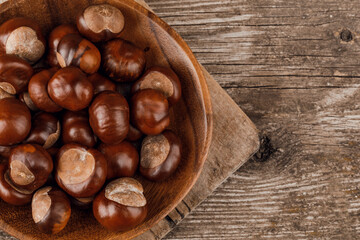 Chestnuts on an old wooden table