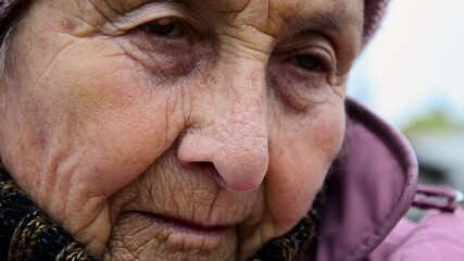 Old grandmother close up. Lonely old woman. Sad old grandmother. Grandma's wrinkled face in close-up. Elderly woman in meditation. The eyes of an aged mother. Loneliness concept in old age