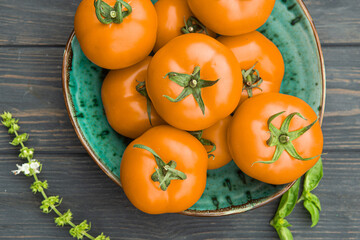 fresh yellow tomatoes on a plate