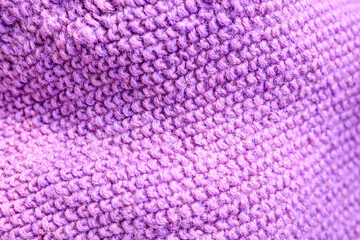 purple knitted item with waves, close-up of knitted details