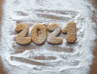 2021 Christmas cookies date on flour background 