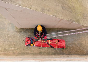rescue firefighter ascending with stretcher