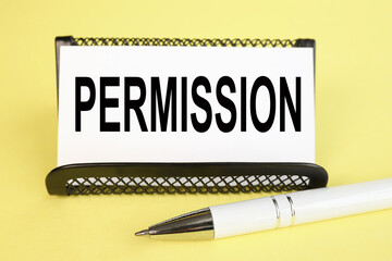 PERMISSION, text on white paper on YELLOW background