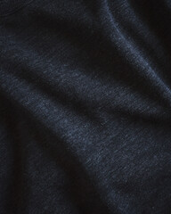 Fototapeta na wymiar Closeup of dark textured fabric.