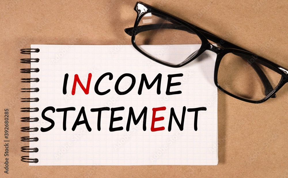 Poster income statement, the text is printed on a piece of paper torn from a notebook on a craft background