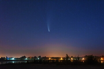 A magical starry night on the river by the Milky Way and a comet in the sky