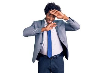 Handsome african american man with afro hair wearing business jacket smiling cheerful playing peek a boo with hands showing face. surprised and exited