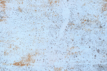 Painted in white old cracked metal rusted background. Metal rust texture. Erosion metal. Scratched and dirty texture on outdoor rusted metal wall.