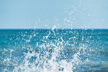 Naklejka na ściany i meble Wave of the sea water at sunny day time.