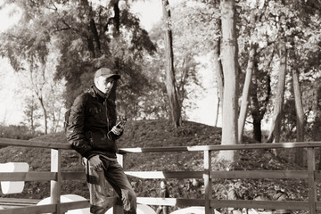 A young guy listens to music while traveling