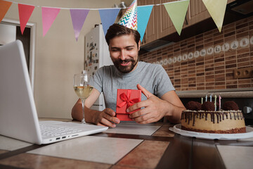 Man celebrating birthday online in quarantine time.