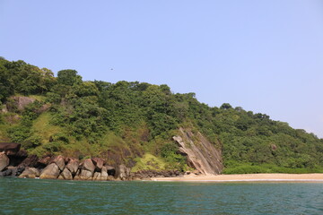 rocky green island of butterflies in South Goa, India