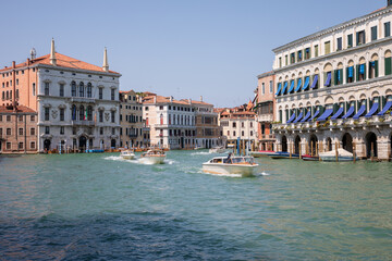 Panoramic view of Grand Canal (Canal Grande) with active traffic boats