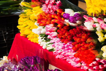 Selling flowers. Bouquets of colorful tulips