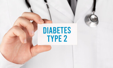 Doctor holding a card with text Diabetes Type 2, medical concept