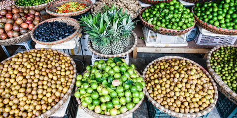 tropical spices and fruits sold at a local market in Hanoi (Vietnam)