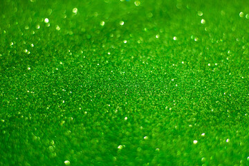 Celebration background,  perfect for Christmas or New Year,  green glitter, selective focus