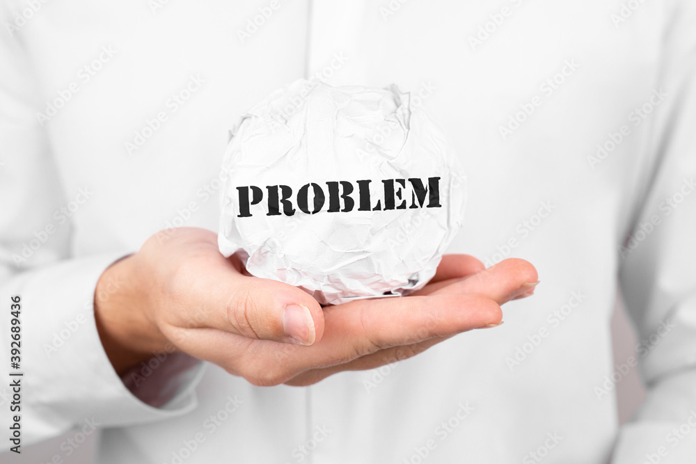 Poster man holds crumpled paper with text problem in his hands