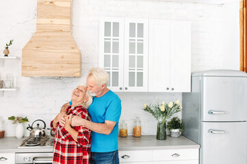 Swenior couple in the kitchen at home