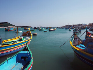 Fototapeta na wymiar Fishmens boats in St.Paul's Bay, Malta