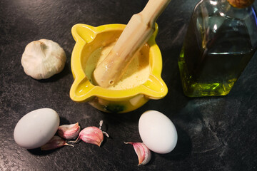 Ingredients of aioli sauce. Eggs, garlics and olive oil
