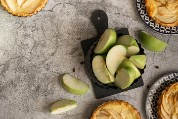 Ready to eat apple pies on grey background