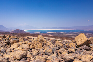 Lac Asal Salt Lake in the far distance with a volcanic landscape in the foreground, Danakil...