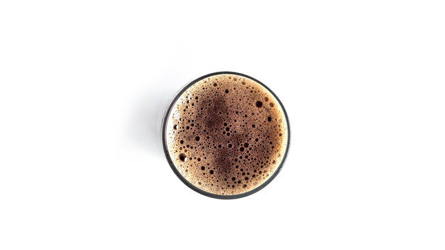 Glass of dark beer on white background. View from the top. High quality photo