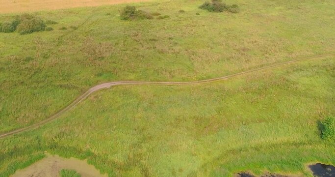 Arable landon Volga river aerial view from flying quadcopter over forest. Landscape panorama. Beautiful nature. Horizon in the background of fields of meadows and sky.