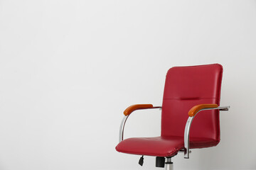 Comfortable office chair on light background. Space for text