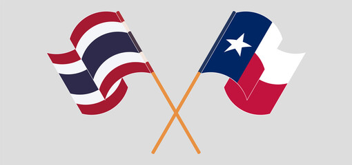 Crossed and waving flags of the State of Texas and Thailand