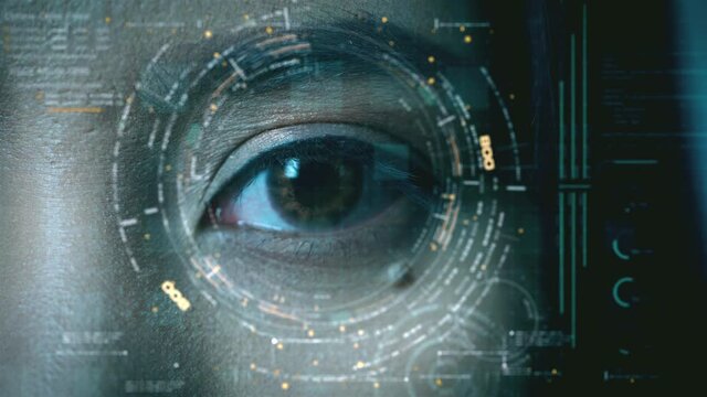 Futuristic biometric retina recognition algorithm technology scanning a young teenager's pupil with invisible infrared light to pick up unique patterns in the iris for personal authentication
