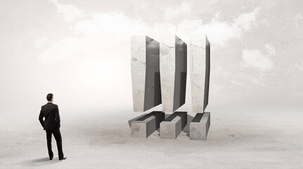 Obraz premium Rear view of a businessman standing in front of !!! abbreviation, attention making concept