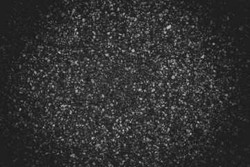 Blank concrete black rough wall for background. Beautiful dark exposed aggregate wall plastered surface background pattern.