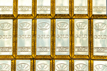 Top view of shiny gold bars stacked up in rows. Gold Bars 1000 grams. Concept of success in business and finance.