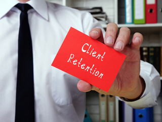  Motivational concept about Client Retention with sign on the piece of paper.