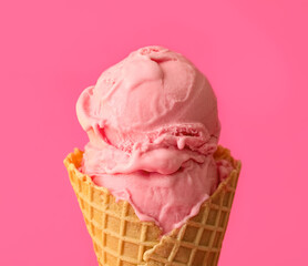 Delicious ice cream in waffle cone on pink background, closeup