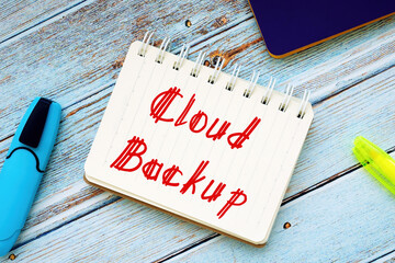 Business concept meaning Cloud Backup with inscription on the piece of paper.