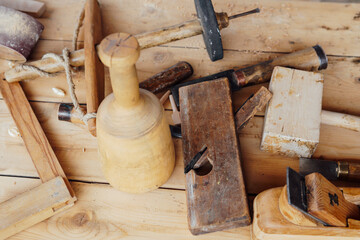 tools to work with the carpenter's wood on the table as a background