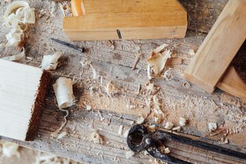 tools to work with the carpenter's wood on the table as a background