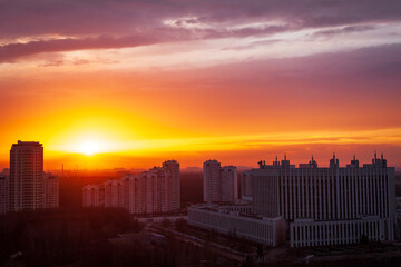 horizontal panoramic sunset over the city industrial architecture buildings sun explosion