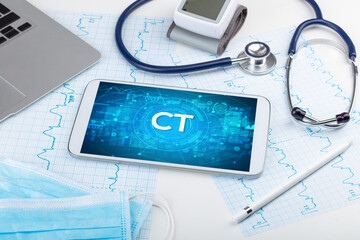 Close-up view of a tablet pc with CT abbreviation, medical concept