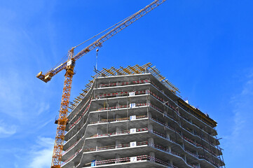 Crane and highrise construction site