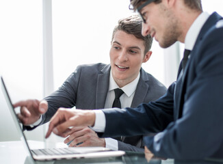 business colleagues discussing online information