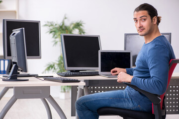Young male it specialist working in the office